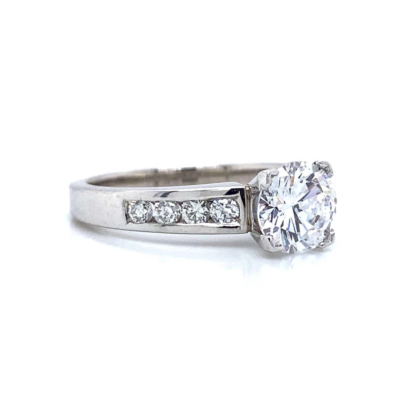 Side Stone Channel Set Engagement Ring in Platinum