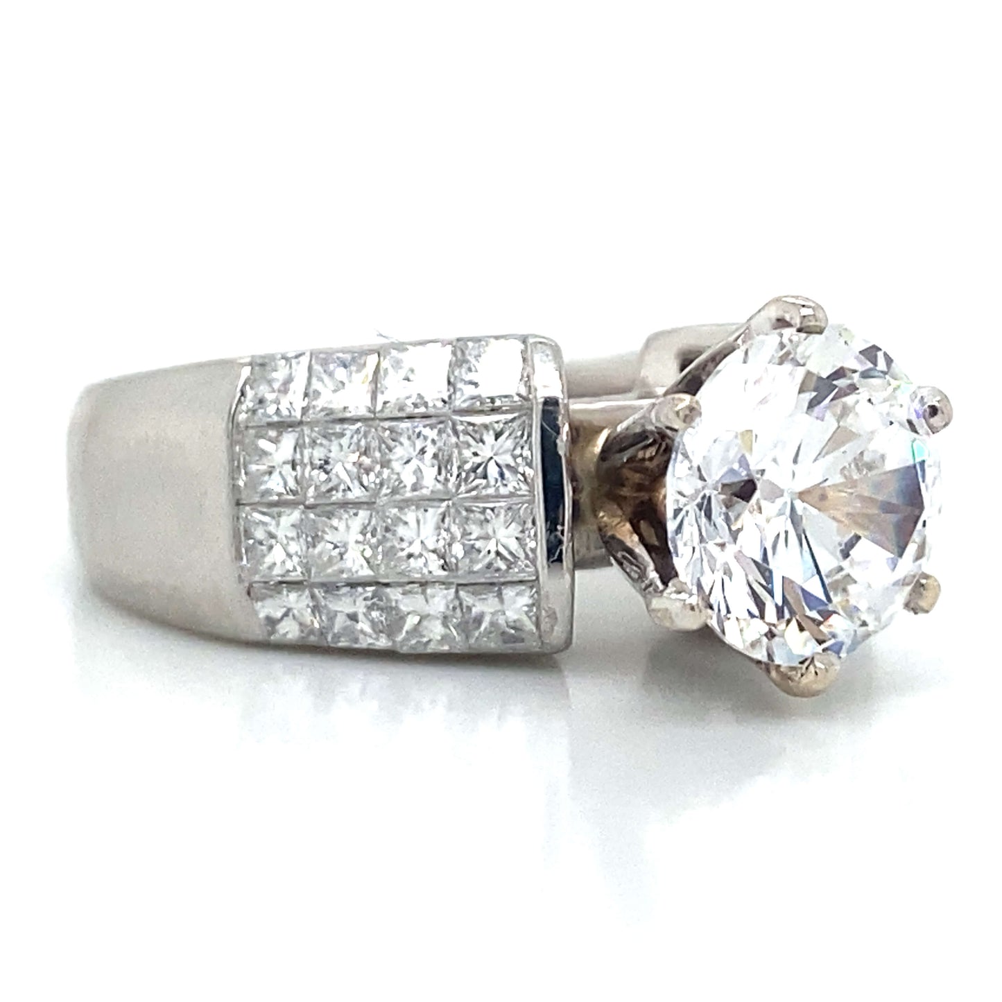 Side Stone Invisible Set Engagement Ring in Platinum