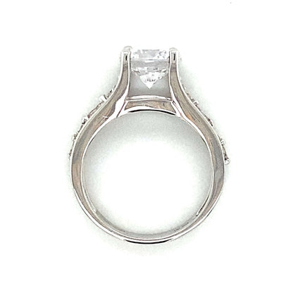 Side Stone Graduating Floating Set Engagement Ring in 18K White Gold